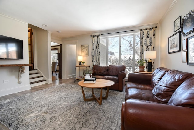 living room with hardwood / wood-style flooring and ornamental molding