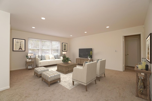 living room with recessed lighting, light colored carpet, and baseboards