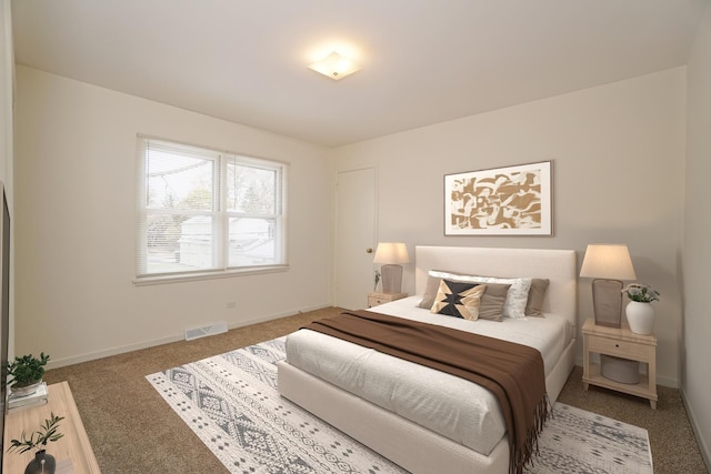 bedroom featuring carpet floors, visible vents, and baseboards