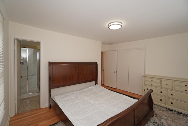 bedroom with a closet and light wood-style floors