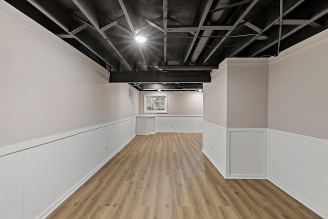 basement featuring light wood-type flooring