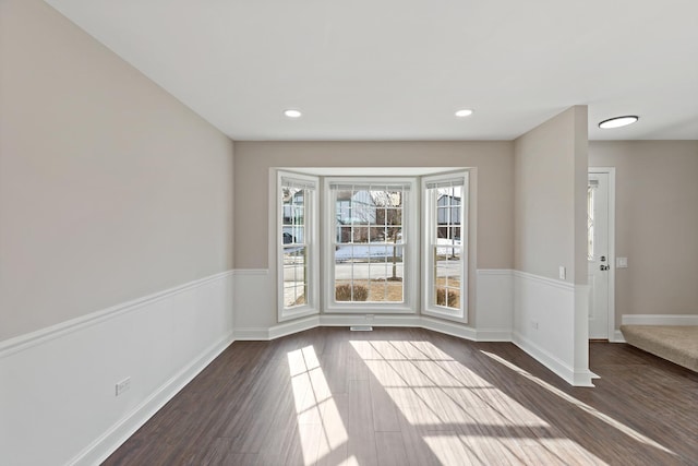 unfurnished dining area with dark hardwood / wood-style flooring