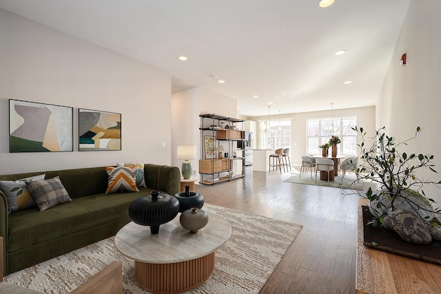 living area featuring wood finished floors and recessed lighting