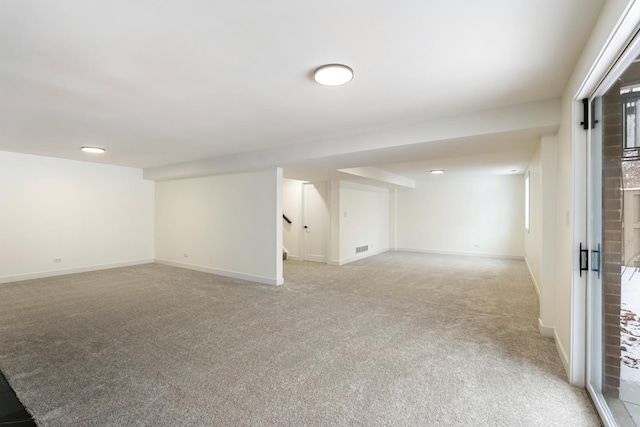 basement with light colored carpet