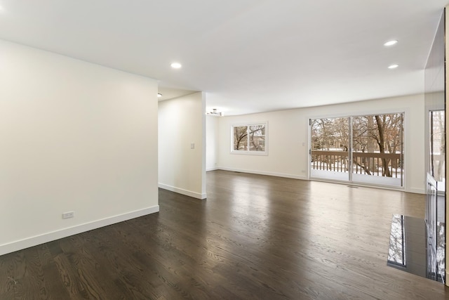 unfurnished living room featuring dark hardwood / wood-style floors