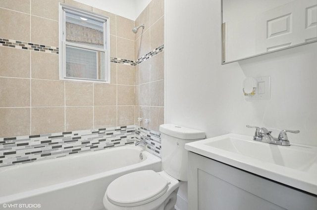 full bathroom featuring bathing tub / shower combination, vanity, and toilet