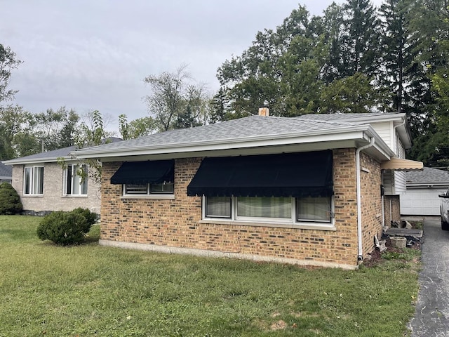 view of home's exterior featuring a yard