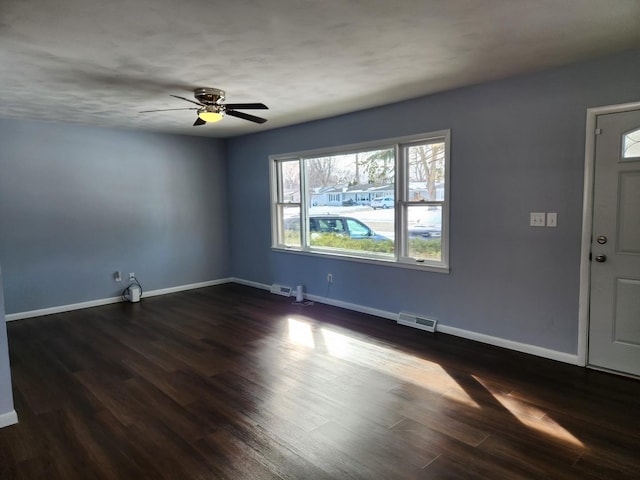 interior space with dark hardwood / wood-style flooring and ceiling fan