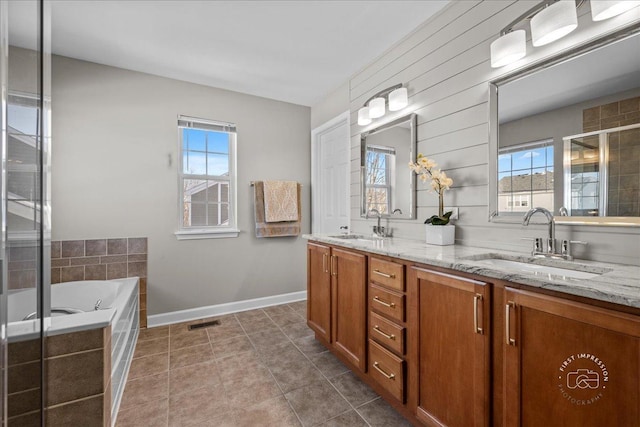 bathroom with vanity, tile patterned flooring, and shower with separate bathtub