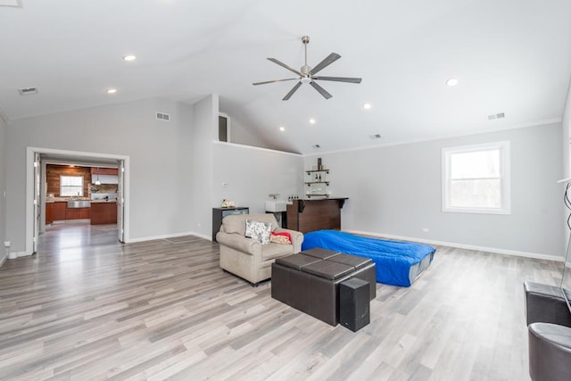 interior space with lofted ceiling, light wood-type flooring, visible vents, and baseboards