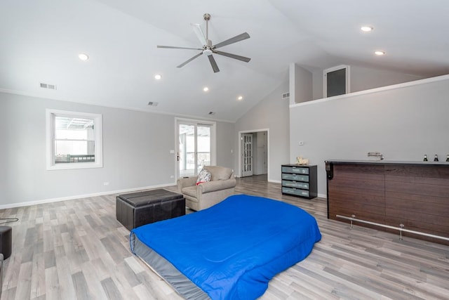 bedroom with visible vents, ceiling fan, light wood-style flooring, and baseboards