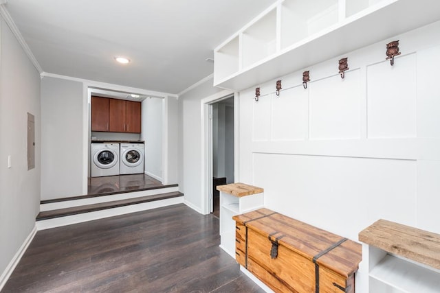 mudroom with dark wood finished floors, baseboards, crown molding, and washing machine and clothes dryer