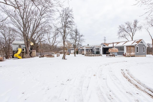 snowy yard with a playground