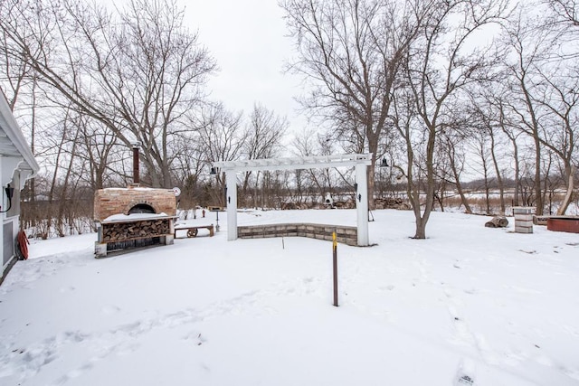 yard covered in snow with a garage