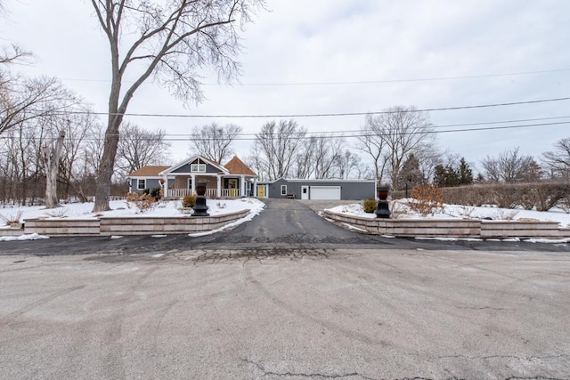 view of front of home with a garage and a porch