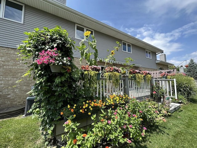 view of property exterior with brick siding