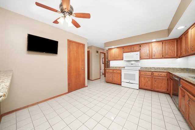 kitchen with brown cabinetry, white appliances, light countertops, and decorative backsplash