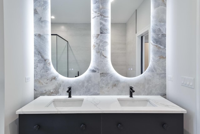 bathroom featuring decorative backsplash and vanity