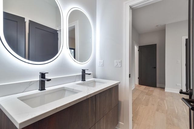 bathroom featuring hardwood / wood-style flooring and vanity