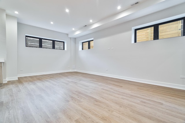 spare room with light hardwood / wood-style floors