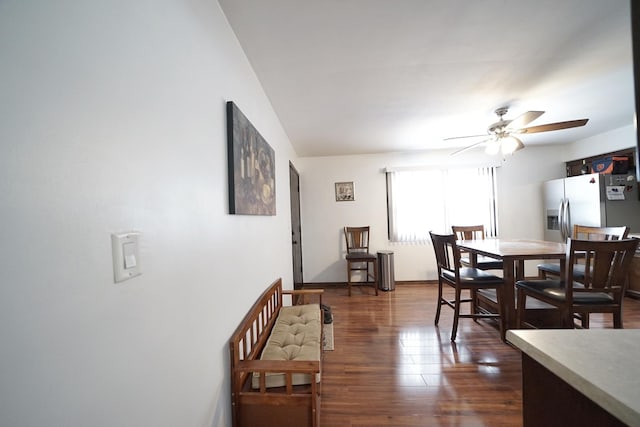 dining space featuring ceiling fan and dark hardwood / wood-style flooring