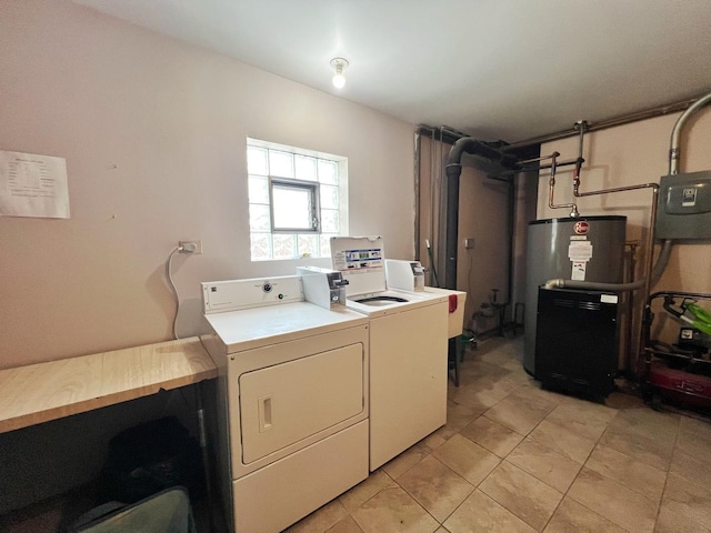 laundry room with washing machine and dryer, sink, water heater, and light tile patterned floors