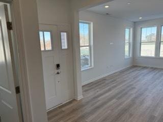 entryway with light hardwood / wood-style floors