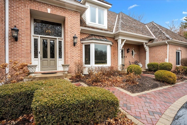 property entrance with brick siding