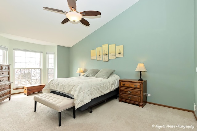 carpeted bedroom featuring lofted ceiling, ceiling fan, and baseboards