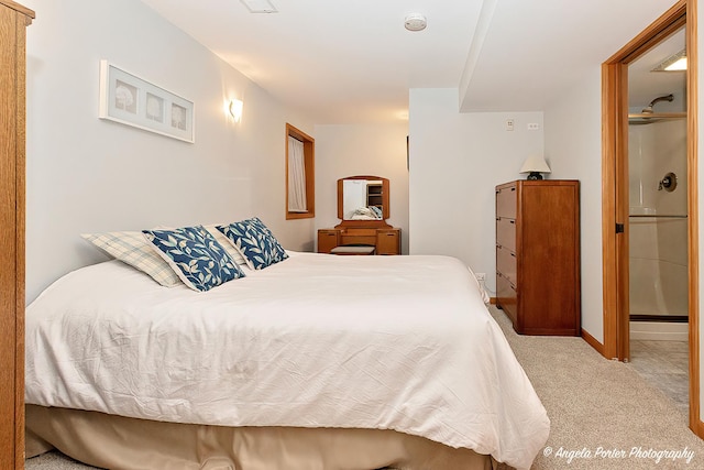 bedroom with light carpet and baseboards