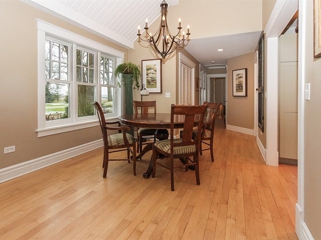 44W906 Berner Rd, Hampshire, IL 60140 - dining room featuring lofted ceiling, wooden ceiling, baseboards, light wood finished floors, and an inviting chandelier