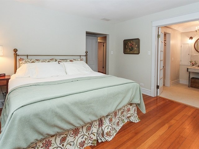 44W906 Berner Rd, Hampshire, IL 60140 - bedroom featuring wood finished floors and baseboards