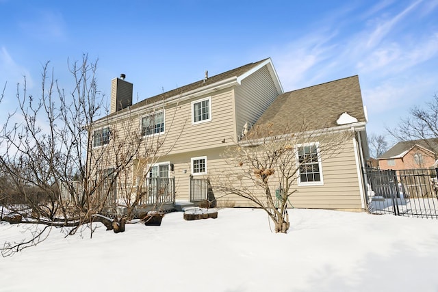 view of snow covered house