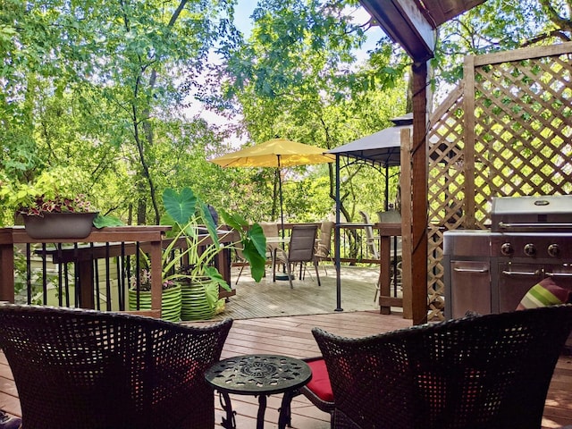 wooden terrace with outdoor dining area