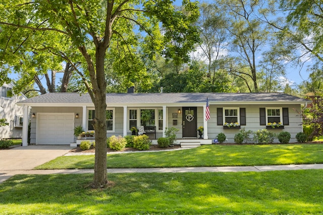 ranch-style home featuring an attached garage, concrete driveway, and a front yard