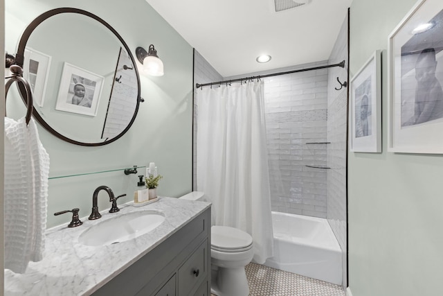 full bath featuring toilet, visible vents, vanity, tile patterned floors, and shower / bath combo with shower curtain