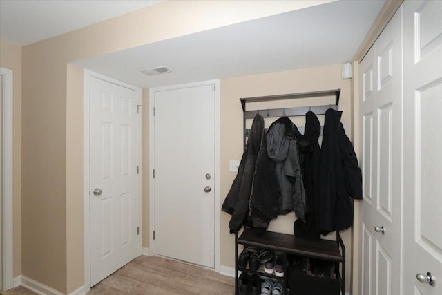 mudroom with light wood-type flooring