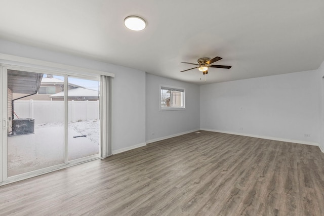 unfurnished room featuring ceiling fan and wood-type flooring