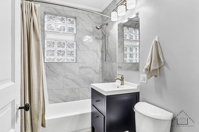 full bath featuring shower / bath combo, vanity, and toilet