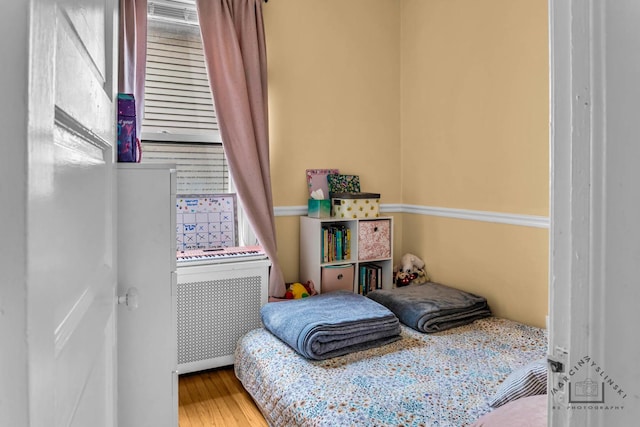 bedroom with wood finished floors