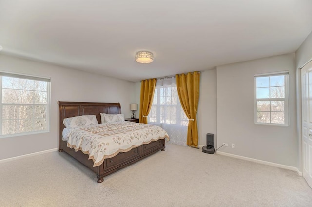 bedroom featuring light carpet