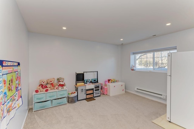 rec room with light colored carpet and a baseboard radiator