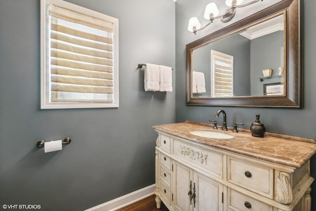 bathroom with baseboards and vanity