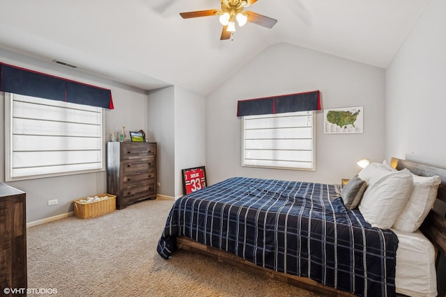 bedroom with lofted ceiling, multiple windows, carpet flooring, and visible vents