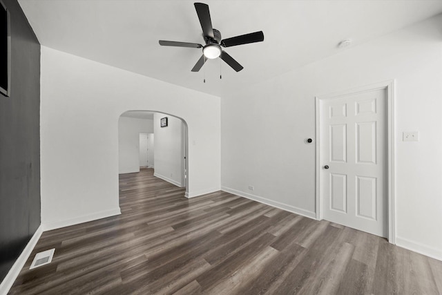 unfurnished room featuring ceiling fan and dark hardwood / wood-style floors