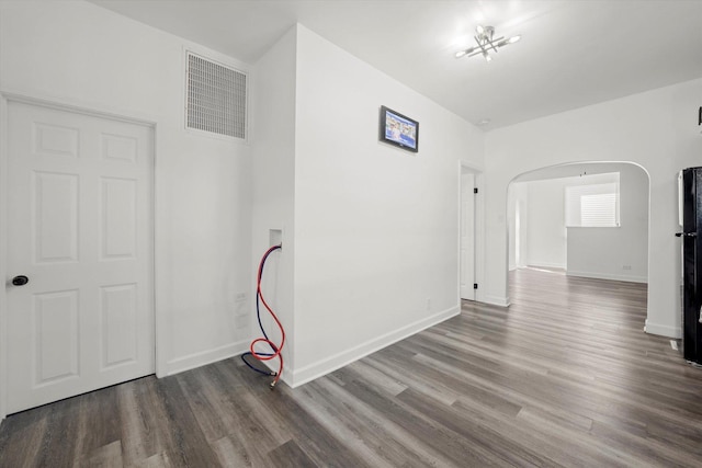 empty room featuring wood-type flooring