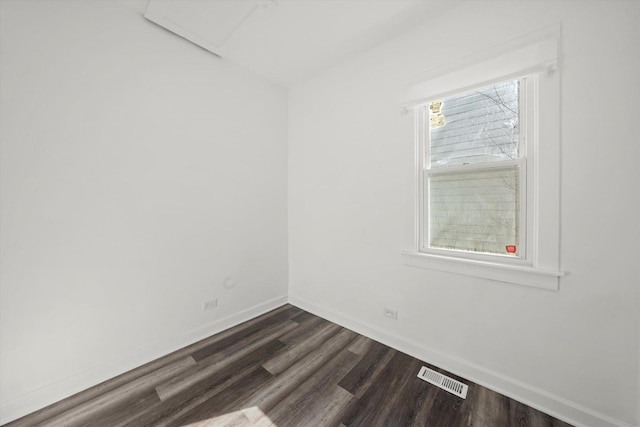 unfurnished room with dark hardwood / wood-style floors