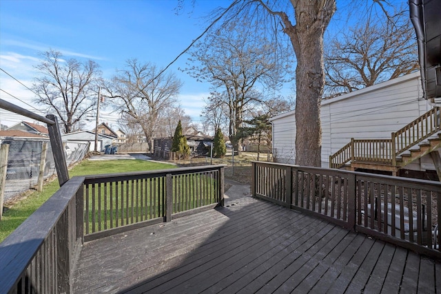 wooden terrace with a lawn