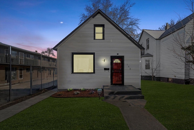 view of front of home with a yard