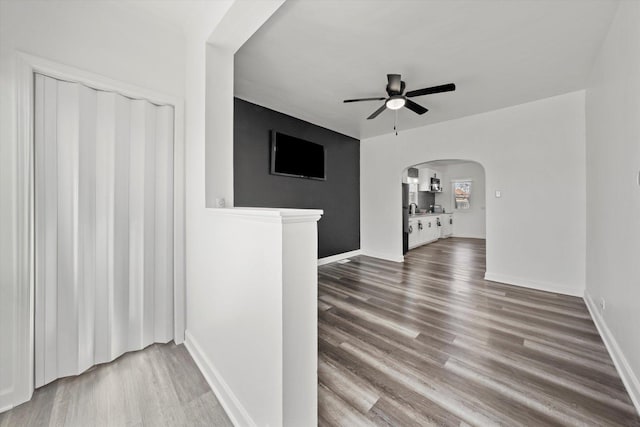 empty room featuring hardwood / wood-style flooring and ceiling fan